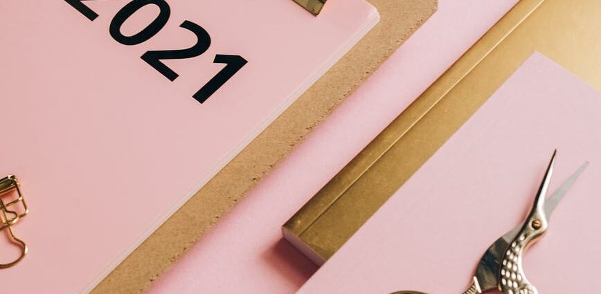 composition of office supplies on pink background