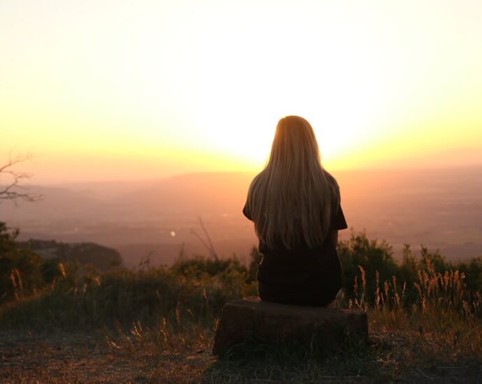 woman looking at sunset