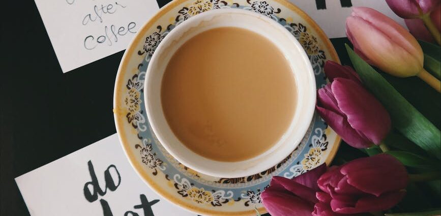 flat lay photography of cup filled with coffee
