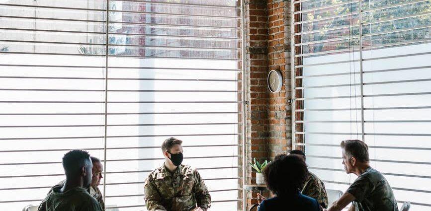 photo of people talking to one another