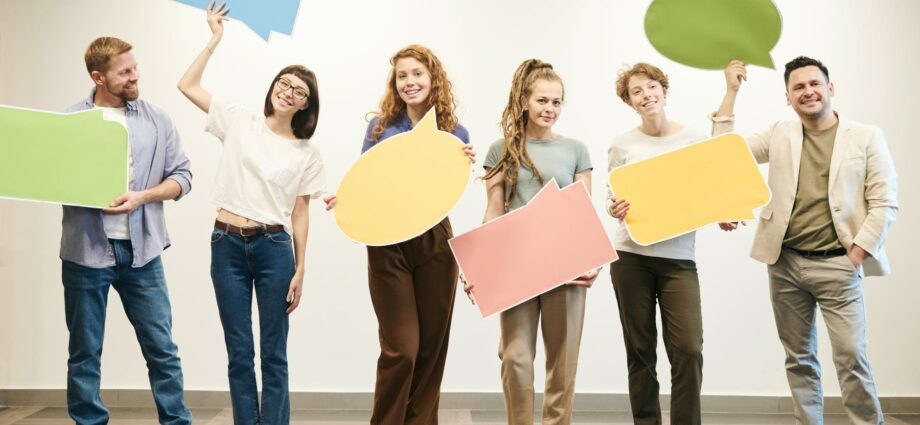 people standing near white wall