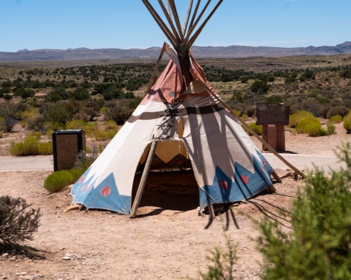 teepee in desert under clear sky