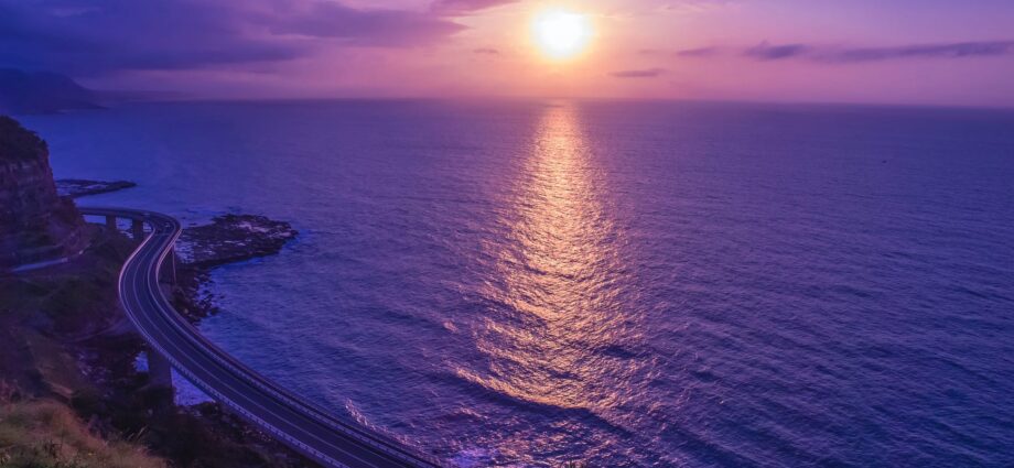 body of water across sunset