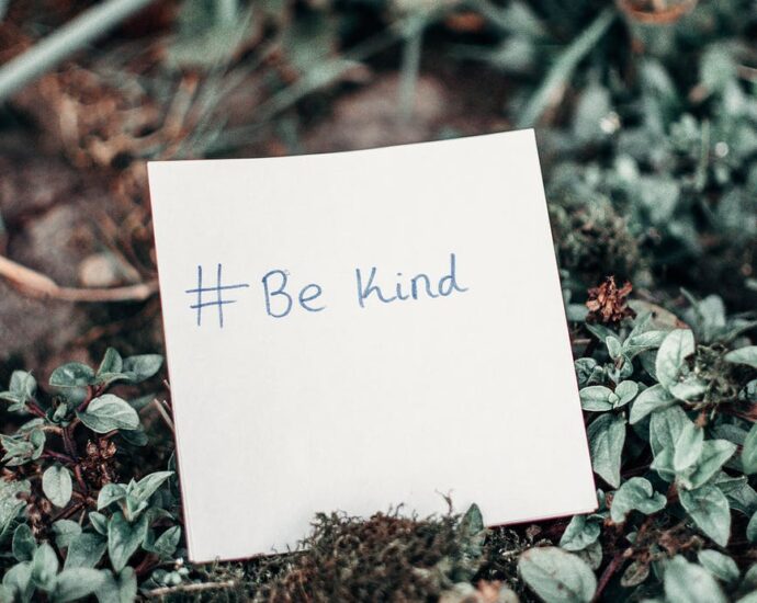 white printer paper with be kind text on plants