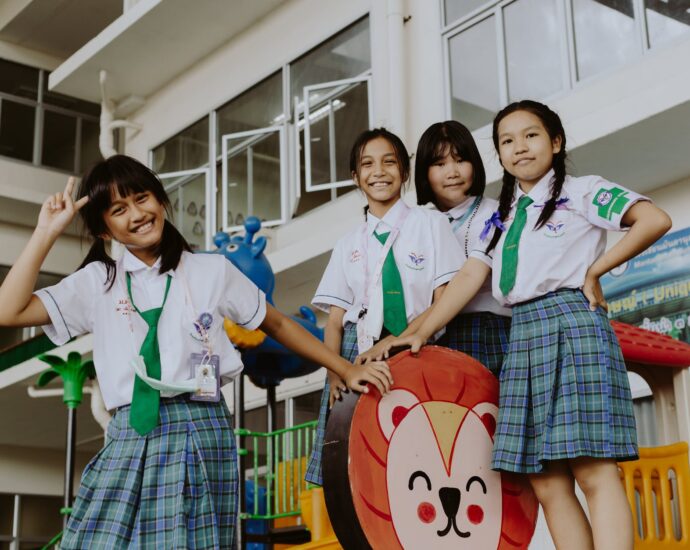 portrait of smiling girls in school uniform