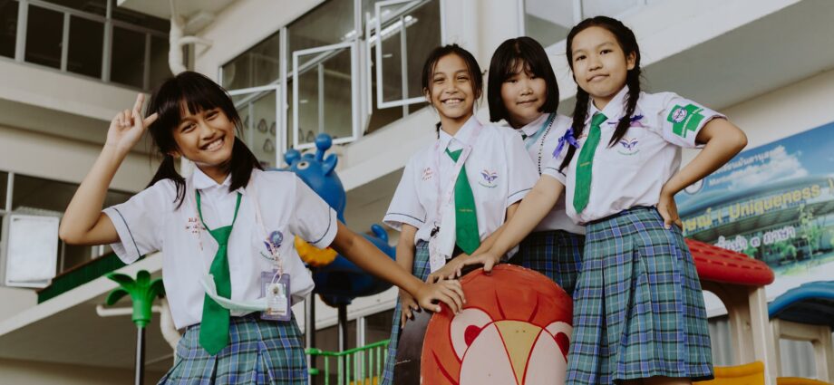 portrait of smiling girls in school uniform